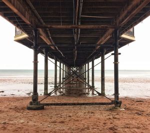 Pier over sea against sky