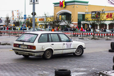 Cars on street against buildings in city