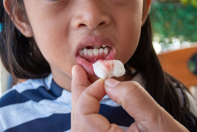 Close-up portrait of boy eating food