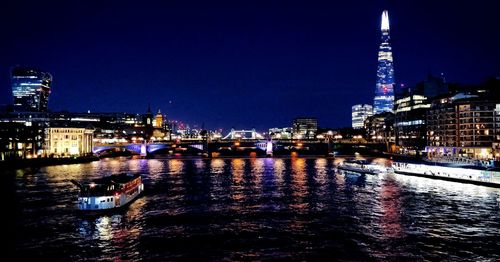 Illuminated buildings at waterfront