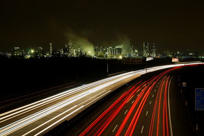 High angle view of light trails on road at night