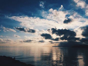 Scenic view of sea against cloudy sky