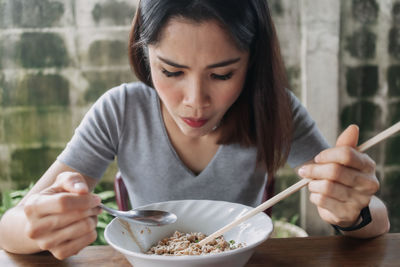 Woman eating food restaurant