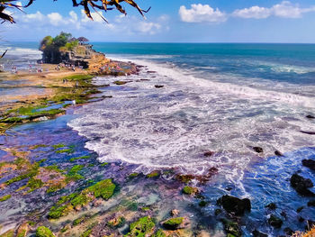 High angle view of tanah lot by sea against sky