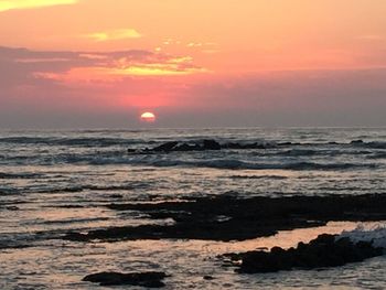 Scenic view of sea during sunset