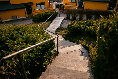 High angle view of footpath amidst buildings in city