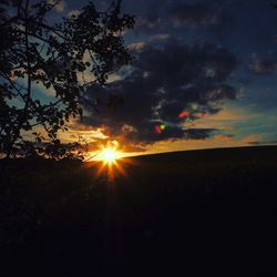 Low angle view of silhouette trees against sky at sunset