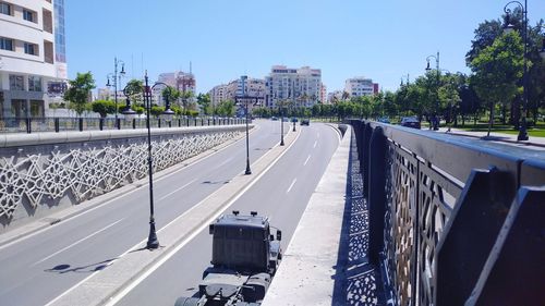 Panoramic view of city street against clear sky