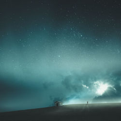 Scenic view of field against sky at night