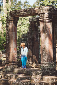 Full length of young woman at angkor wat