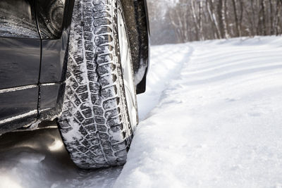 Close-up of snow covered car