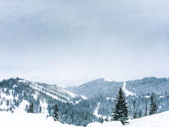 Scenic view of landscape against sky during winter