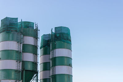 Low angle view of factory against clear sky