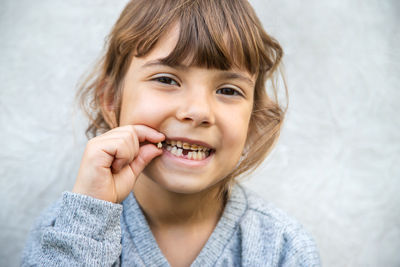 Portrait of smiling girl with broken tooth