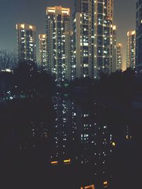 Illuminated buildings in city at night