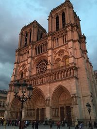 Low angle view of cathedral against cloudy sky