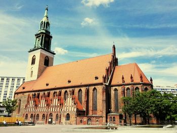 Exterior of historic building against sky in city