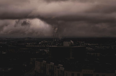 Aerial view of buildings in city at dusk