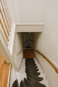 Low section of woman standing on staircase