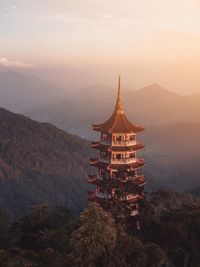 High angle view of traditional building on mountain during sunset