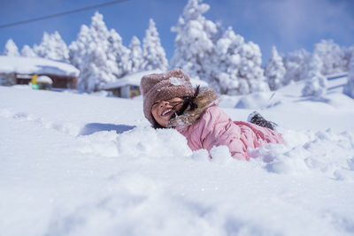 Low section of woman in snow