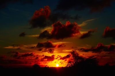 Low angle view of dramatic sky during sunset