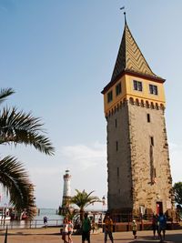 Tourists on top of historic building