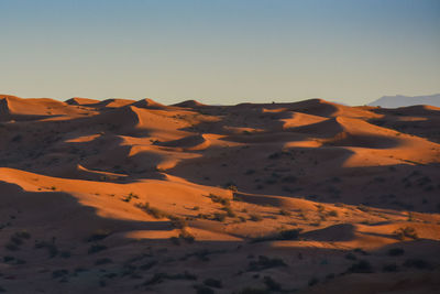 Scenic view of desert against clear sky