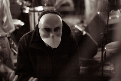 Man wearing mask at night