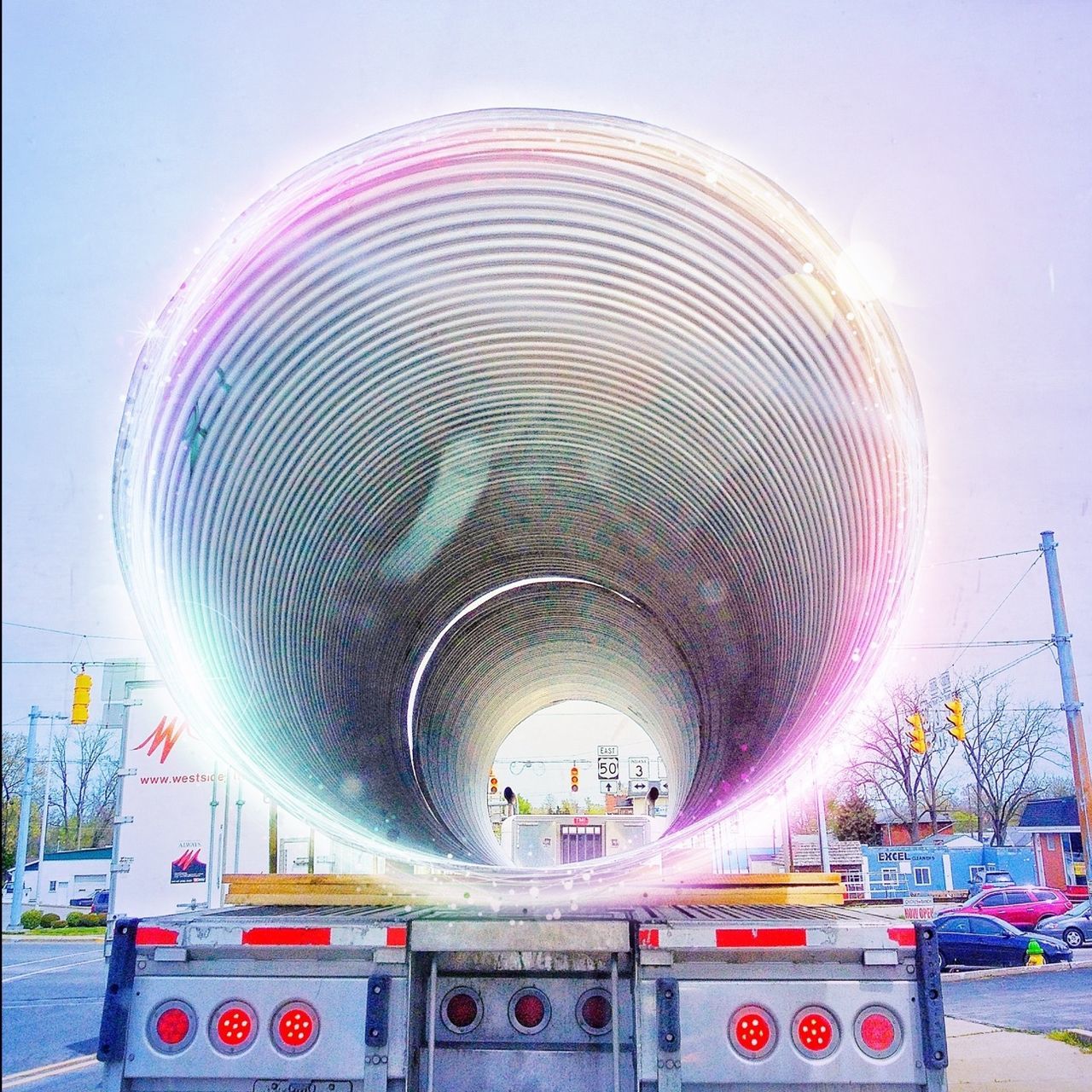 transportation, built structure, arts culture and entertainment, amusement park, amusement park ride, low angle view, circle, sky, architecture, travel, incidental people, outdoors, travel destinations, day, land vehicle, no people, mode of transport, tourism, ferris wheel, modern