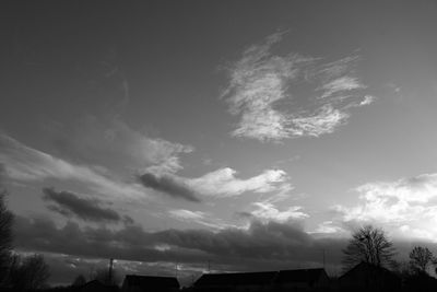 Low angle view of building against cloudy sky