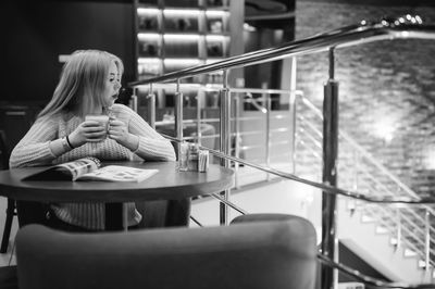 Woman having drink in restaurant