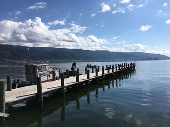 Pier on sea against sky