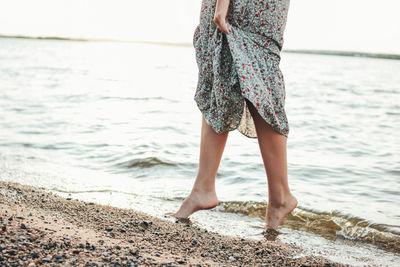 Low section of woman at beach