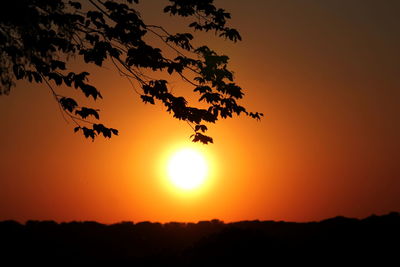 Scenic view of silhouette landscape against romantic sky at sunset