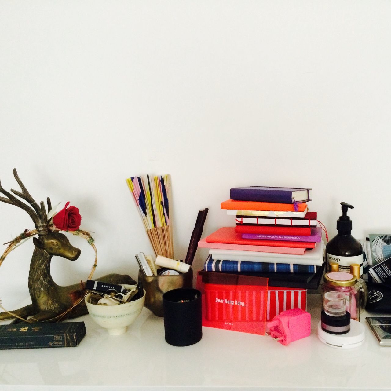 indoors, still life, studio shot, table, variation, white background, copy space, flower, large group of objects, no people, close-up, wall - building feature, retro styled, old-fashioned, home interior, high angle view, arrangement, choice, group of objects, multi colored