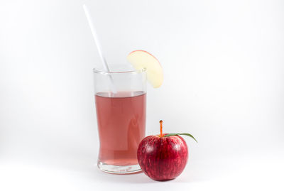 Close-up of red wine against white background