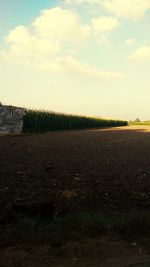 Scenic view of land against sky during sunset