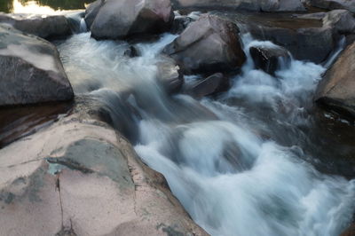 Stream flowing through rocks