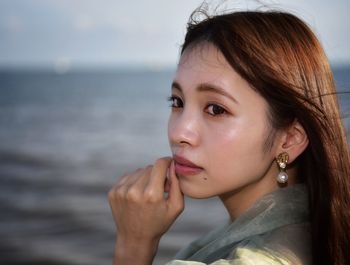 Close-up portrait of a woman looking away
