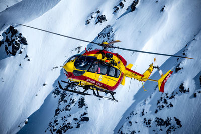 Ski lift on snowcapped mountain