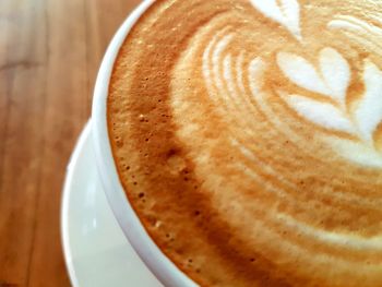 Close-up of cappuccino on table