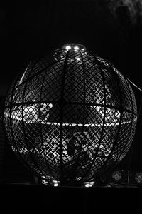 Close-up of illuminated ball in cage