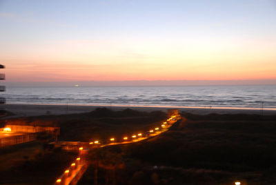 Scenic view of beach against sky at night