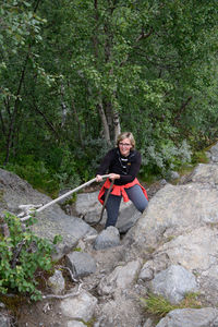 Tourist is climbing on a trail