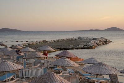 Scenic view of beach against sky during sunset