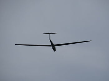 Low angle view of airplane flying in sky