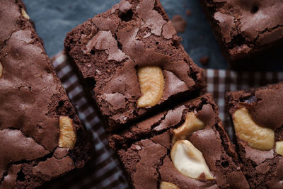 High angle close-up of brownies with napkin on slate