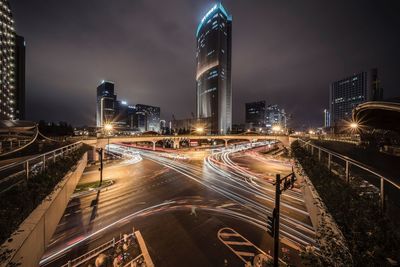 High angle view of light trails on city at night