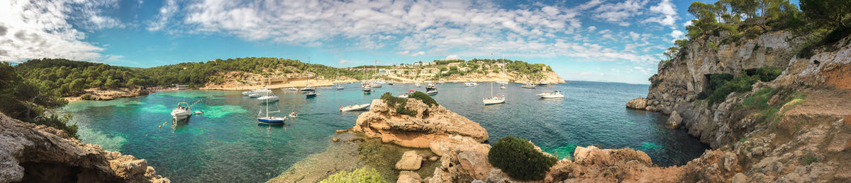 Panoramic view of boats sailing in sea